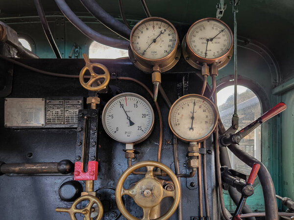 Some essential manual controls for control and operation on an old steam locomotive
