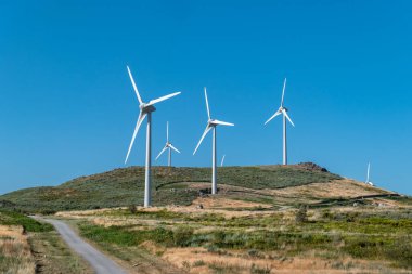 High in the mountains and surrounded by nature, the wind farm in Serra do Caramulo in Portugal clipart