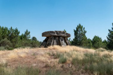 Rear view of the Fonte Coberta dolmen in Alijo, a prehistoric megalithic monument in Portugal clipart