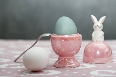 Easter egg in a decorative stand with a rabbit. Easter