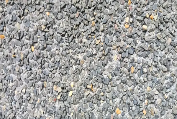 stock image structure of a house whose wall is made up of plates with small stones