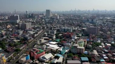 Aerial drone view of Bangkok city downtown. Asian small community with heavy traffic in the Capital of Thailand