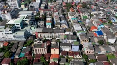 Aerial View Asia City suburb in the day Drone shot Dolly in forward small building in Bangkok.