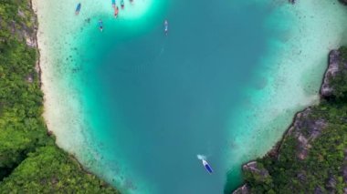 Aerial drone photo of iconic tropical turquoise water Pileh Lagoon surrounded by limestone cliffs, Phi phi islands, Thailand.
