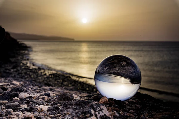 stock image a beach with a ball on the shore of the sea