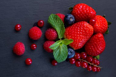 Exotic fruit rich in vitamins and antioxidants, such as red berries.