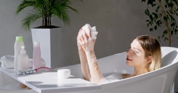 Pretty Young Woman Spreading Foam Arms While Relaxing Bathtub Weekend — Stock Video