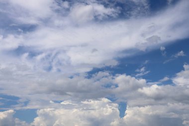 Picture of white clouds bright sky open aura sun shining in gradient.