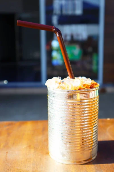 Antique street coffee and milk tea in Thailand in an old-fashioned milk can, vintage style.