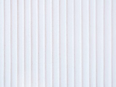 Arkaplan resmi beton bir duvardan minimalist bir tarzda çekilir ve beyaz tonlarda eşsiz bir çizgi deseni vardır..