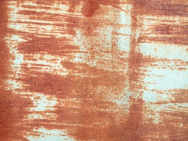 Kullanılmış eski bir galvanizli demir kapıdaki paslı arkaplan resmi, metin için alanı olan güzel bir doğal desendir..