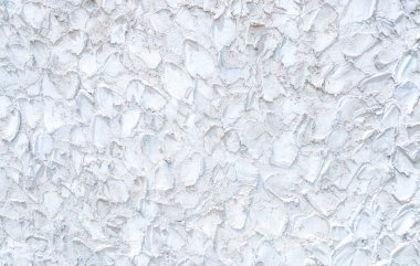 Beyaz beton bir duvarın arkaplan resmi eşsiz ve güzel görünmesini sağlar..