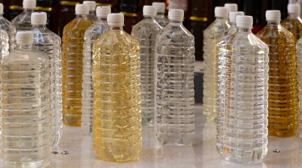 Close Many Plastic Bottles Clear Yellow Liquid Homemade Alcohol Bottled — Stock Photo, Image