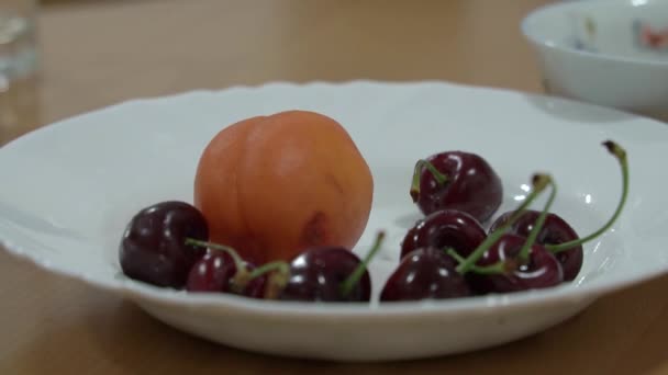 Close Womens Hands Pulling Red Cherries Out White Plate Table — Stock Video