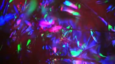 Abstract light glare from a concert spotlight at a club party. multicolored light highlights. Sunbeams from a colored flashlight. Abstract color gradient.