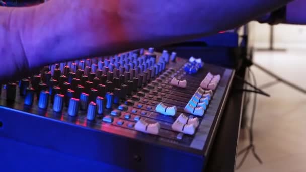 Sound Engineer Adjusts Sound Quality Party Red Light Using Special — Stock Video