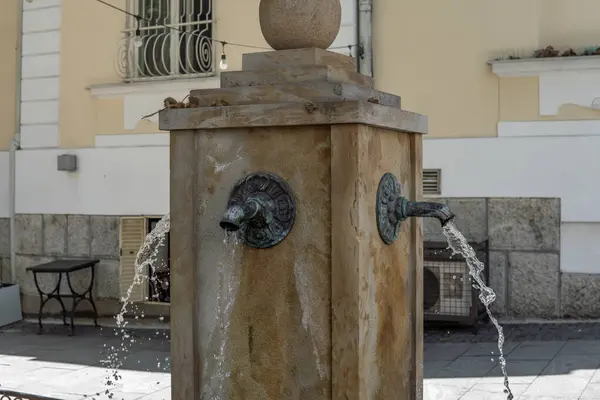 stock image close-up of an old fountain with drinking water. Drinking water in the city center. A faucet with water on the street. High quality photo