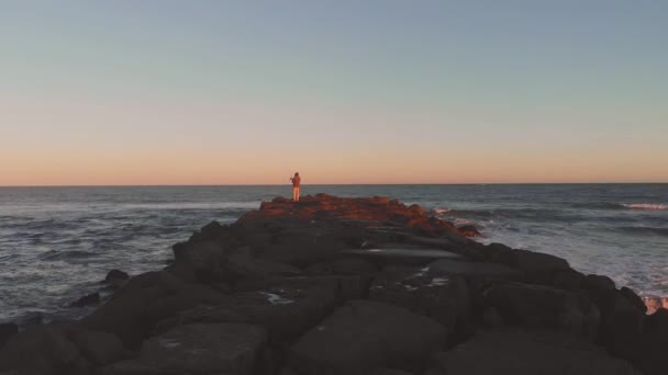 Drone Video Man Fishing Jetty Sunset — Vídeo de Stock