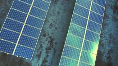 drone video of rows of solar panels in an outdoor field