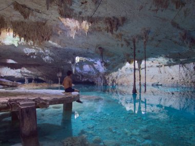 cenote taak bi ha in tulum mexico natural underground swimming hole in a cave  clipart