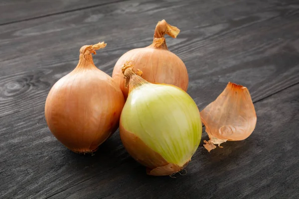 Stock image onion on a wooden board