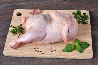 half of the chicken on the board