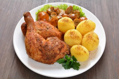 baked chicken meat with potatoes and mushrooms
