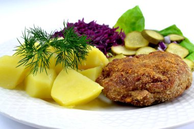 minced cutlet with potatoes, cucumber and cabbage