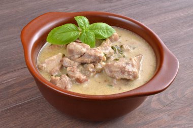 sauce with pork in a bowl