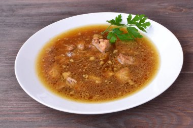sauce with pork meat on a plate