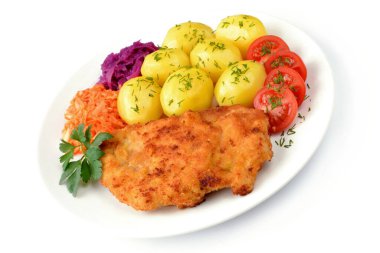 fried chicken fillet with potatoes, tomato and salads