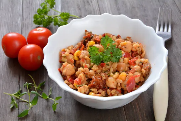 salad with groats, chickpeas and dried tomatoes