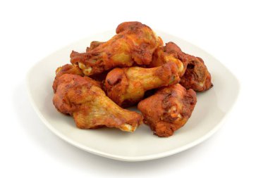 baked chicken wings on a white background