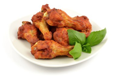 baked chicken wings on a white background
