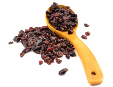 dried cranberries on a wooden spoon