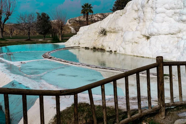 hot spring limestone white pools, hydrothermal or geothermal springs in pamukkale, Turkey natural heritage, winter season view