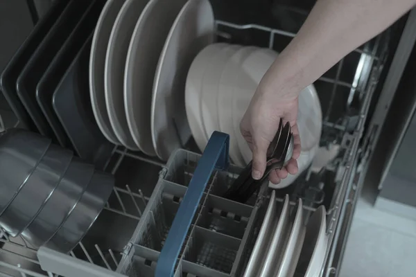 Woman Hands Putting Cutlines Full Dishwashing Machine White Black Gray — Stock Photo, Image