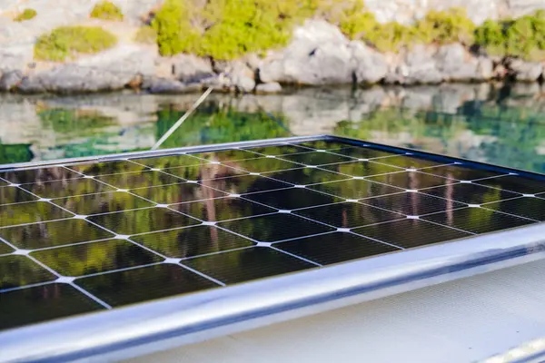 stock image marine solar panels on top of multihull boat, environment and sea ocean friendly sustainable technology