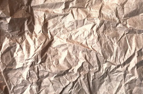 Arka plan için buruşuk kahverengi kağıt. kahverengi kağıt arkaplan.