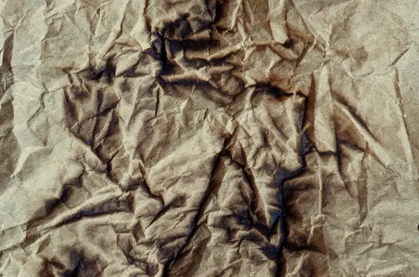 Eski kağıt çarşaf. Toz ve kirli lekelerle dolu boş bir arka plan. Eski ve antika sanat konsepti. Ayrıntılı yakın çekim stüdyo çekimi. Ön manzara. Ayarlanmış