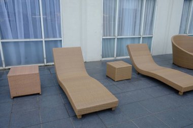 hotel patio with sunbeds by the pool