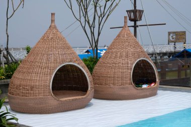 rattan huts on a beach resort 