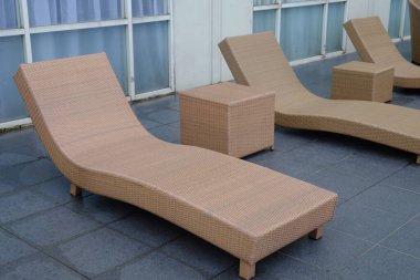 hotel patio with sunbeds by the pool
