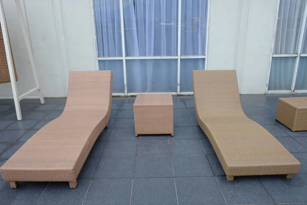 hotel patio with sunbeds by the pool