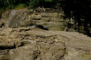 sedimentary layers formed from volcanic lava in river