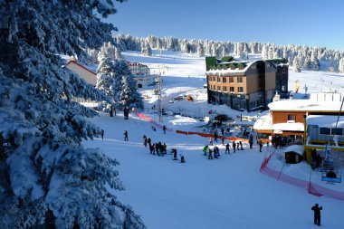 Bursa, Turkey - January 3, 2020: Thick snow on Mount Uludag, Bursa city, Turkey. Foreign tourists are skiing and riding the cable car in Uludag.