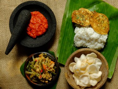 Nasi rames sambal telur dadar, a kind of street food in Indonesia. Indonesian food. Top view.