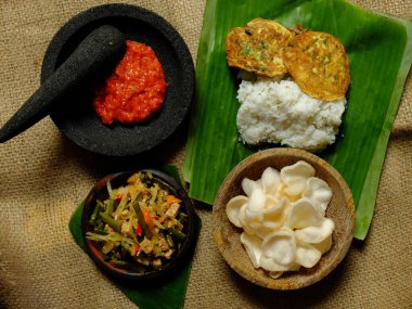 Nasi rames sambal telur dadar, a kind of street food in Indonesia. Indonesian food. Top view.