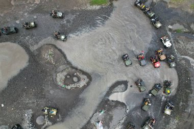 Yogyakarta, Indonesia. June 19, 2022. Off-road jeep cars drive on sandy river. 4 wheel drive vehicles. 4x4 off-road cars adventure in natural terrain. off-roading adventure in Indonesia.