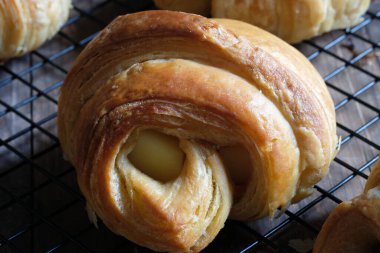 Close up of croissants on a cooling rack